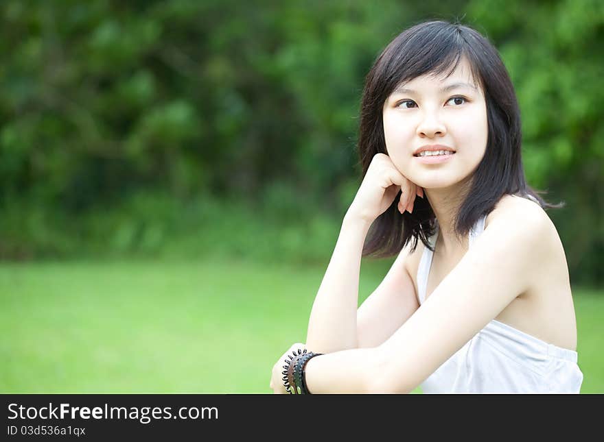 Beautiful Asian Chinese/Japanese girl in white dress enjoying outdoors. Beautiful Asian Chinese/Japanese girl in white dress enjoying outdoors