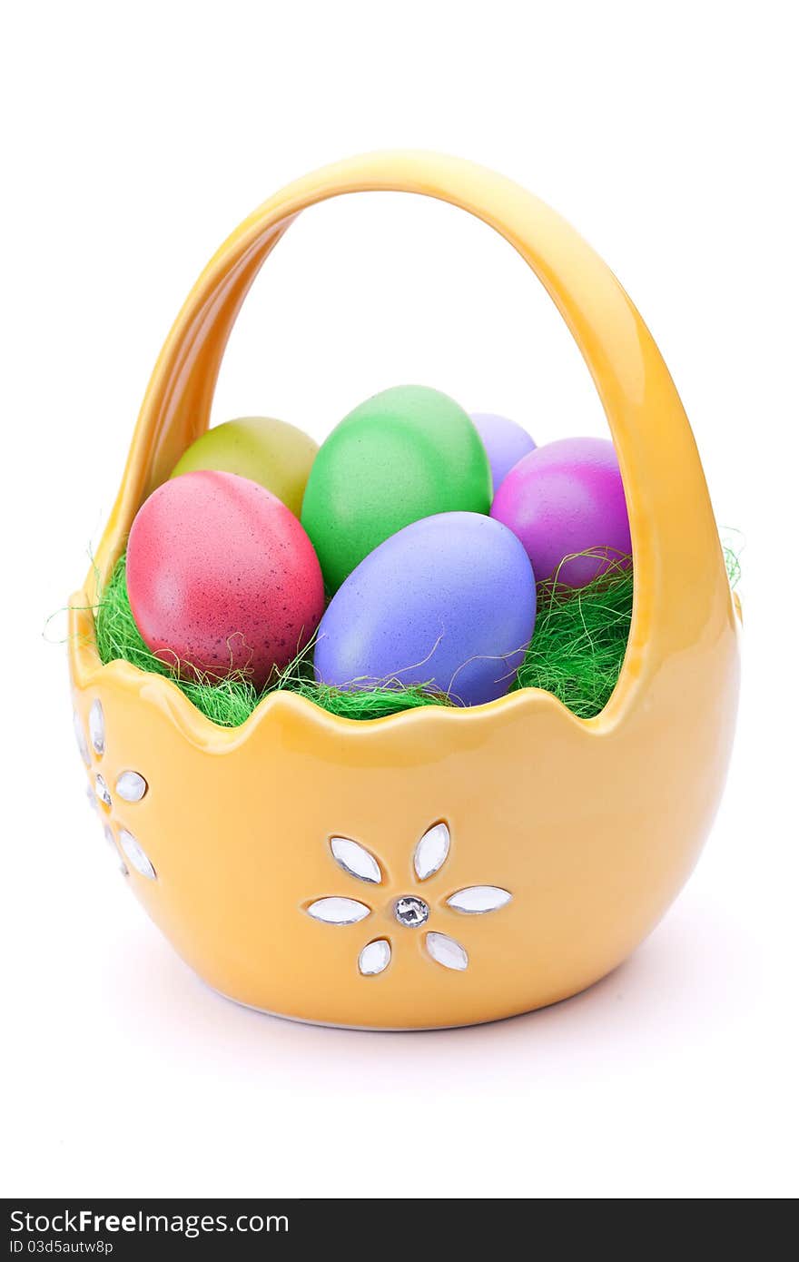 Basket full of Easter eggs isolated on white. Basket full of Easter eggs isolated on white