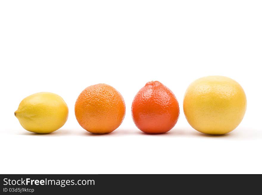 Group of fruits arranged in a row. Isolated on white. Group of fruits arranged in a row. Isolated on white.