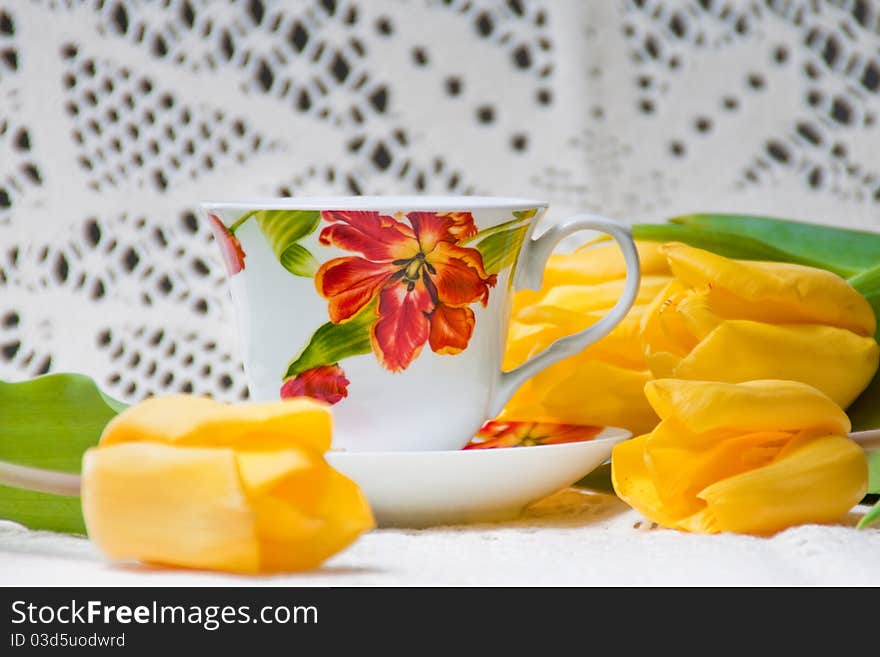 Morning Cup Of Tea With Yellow Tulips