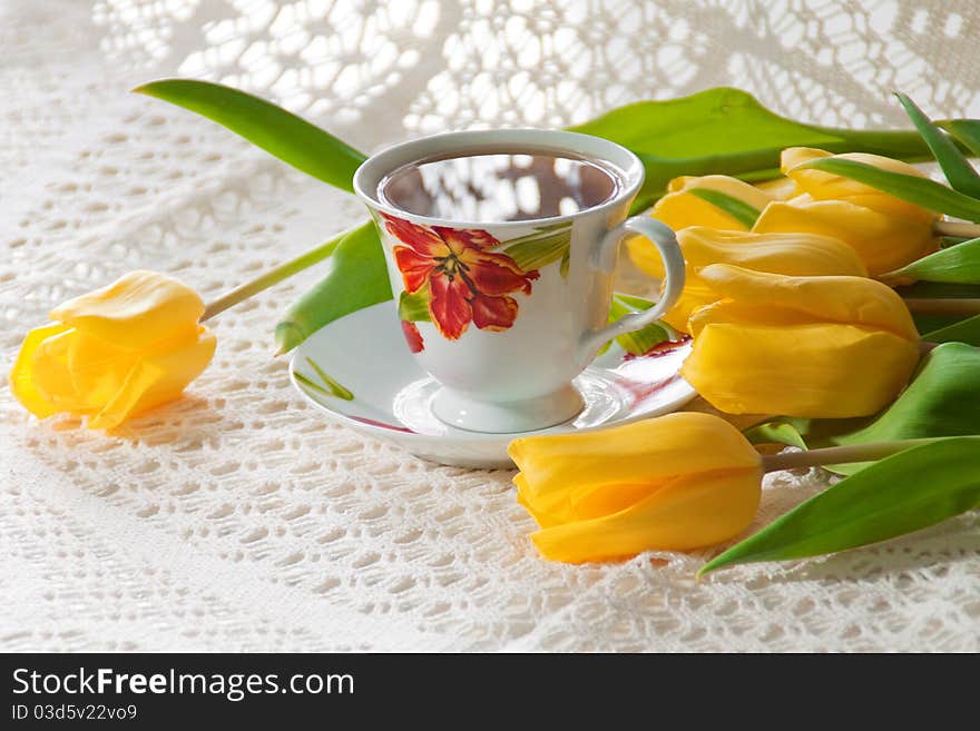 Morning Cup Of Tea With Yellow Tulips