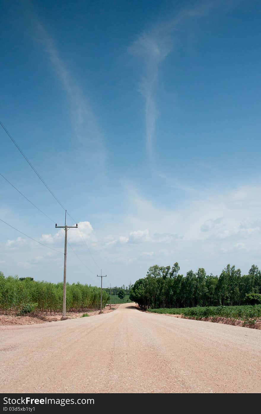 A dirt dusty road across ranches in rural Thailand. A dirt dusty road across ranches in rural Thailand