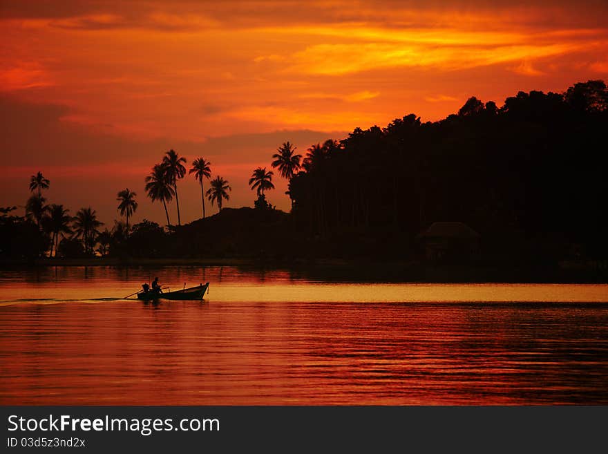 Colorful sunset over the ocean and a boat, Thailand. Colorful sunset over the ocean and a boat, Thailand.