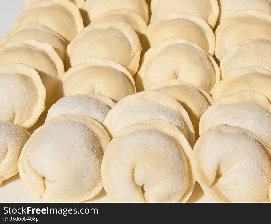 Dumplings hand sculpting, raw and frozen. Culinary prefabricated