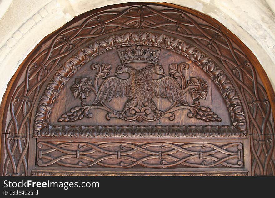 Close up of the top of the wooden door that leads into the Old Church Sinaia Monastery, Sinaia, Romania. Close up of the top of the wooden door that leads into the Old Church Sinaia Monastery, Sinaia, Romania