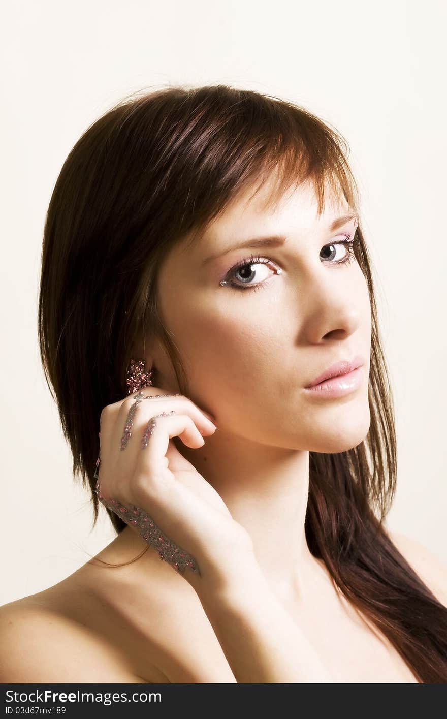 Young woman portrait with rhinestones on hands