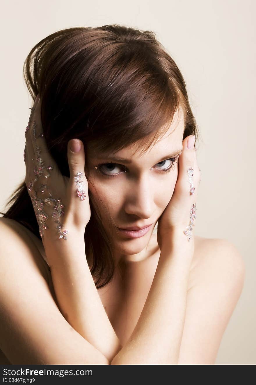 Young woman portrait with rhinestones