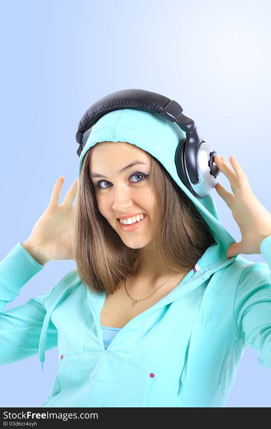 The beautiful young woman with headphones