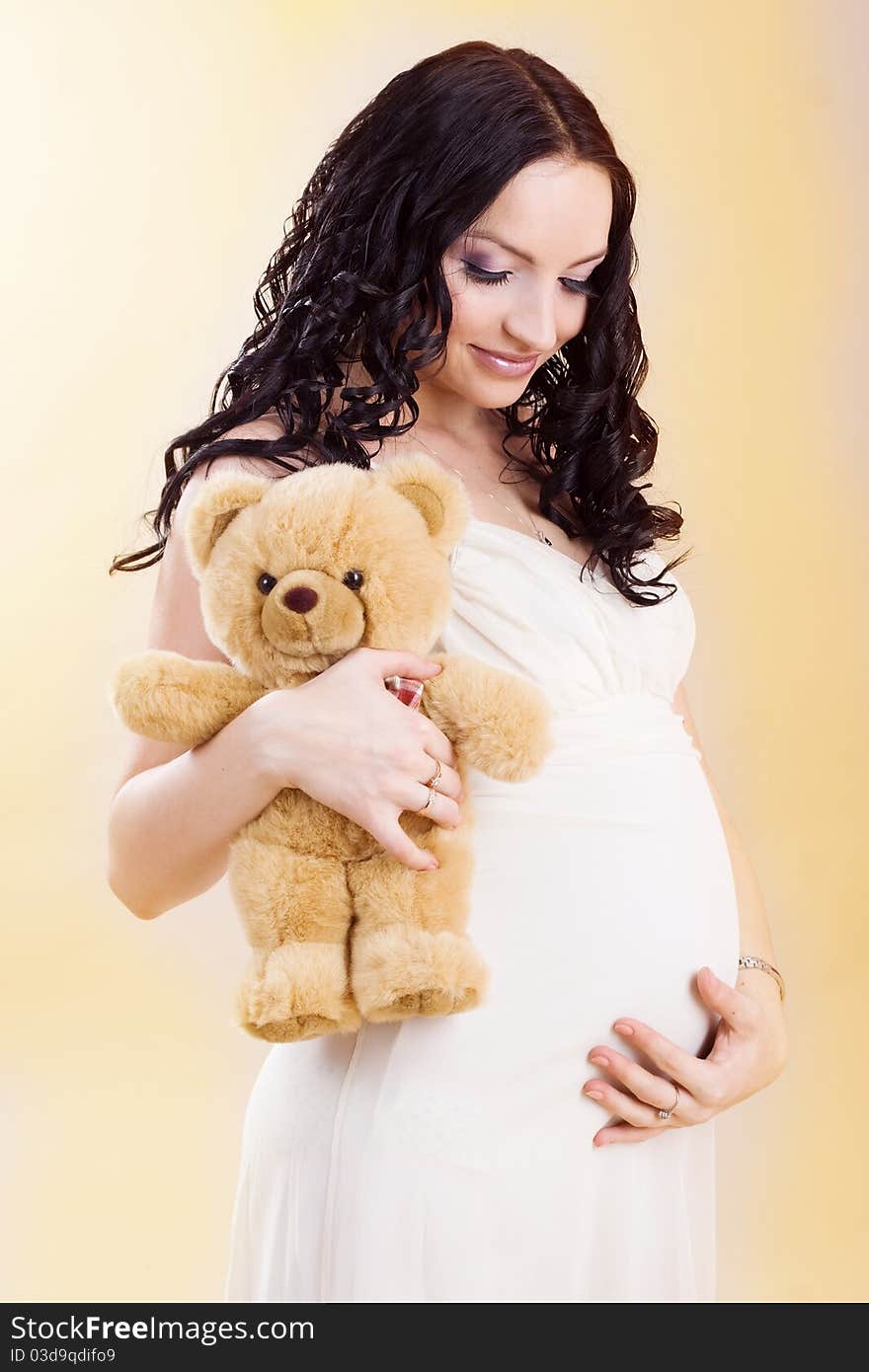 Pregnant woman with teddy bear. Pregnant woman with teddy bear