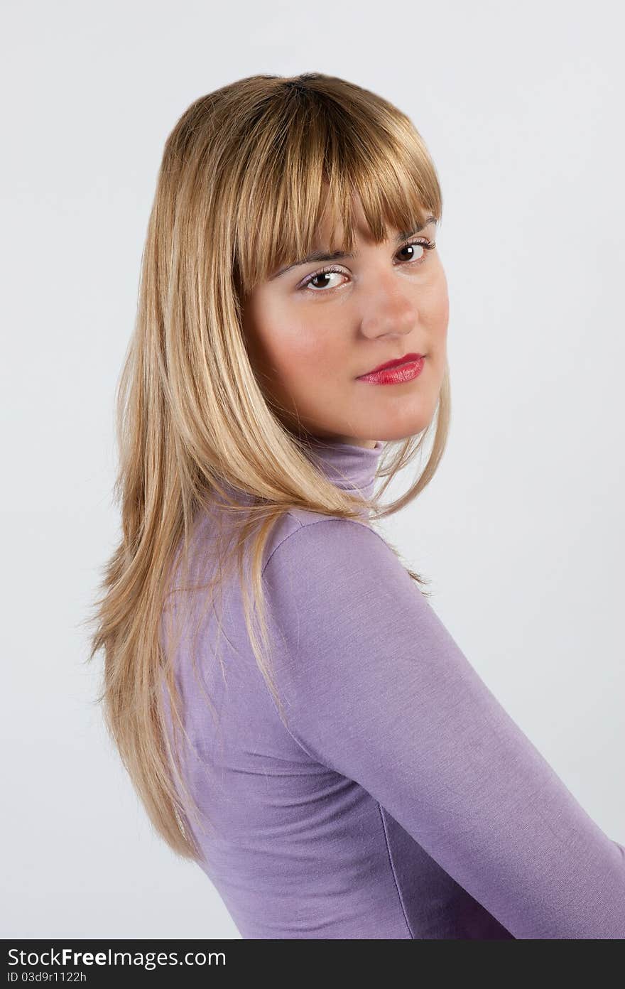 Smiling young woman on white background