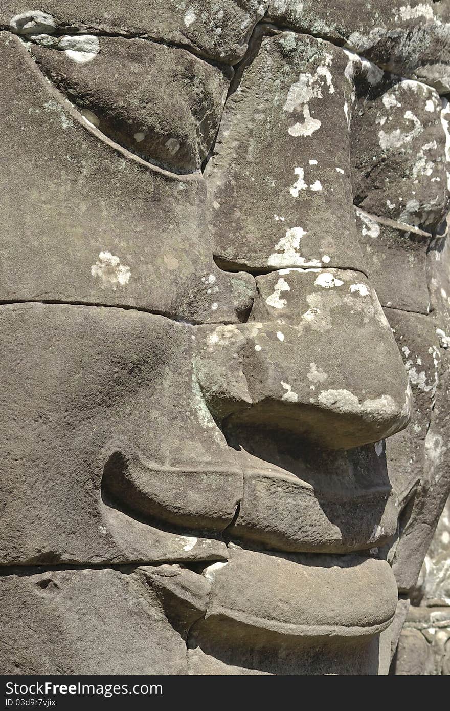 Stone head on towers of Bayon temple in Angkor Thom, Cambodia