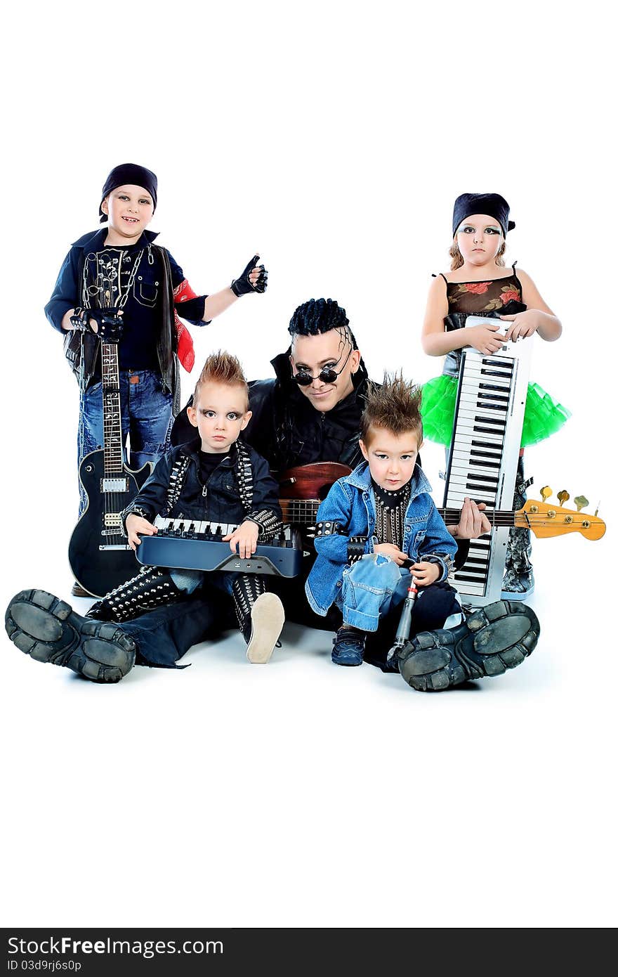 Heavy metal musician with a group of stylish children. Shot in a studio. Isolated over white background. Heavy metal musician with a group of stylish children. Shot in a studio. Isolated over white background.