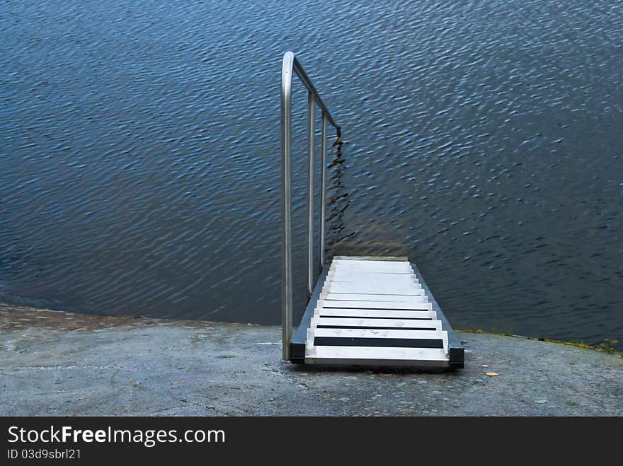 Steps and railing straight into the water. Steps and railing straight into the water