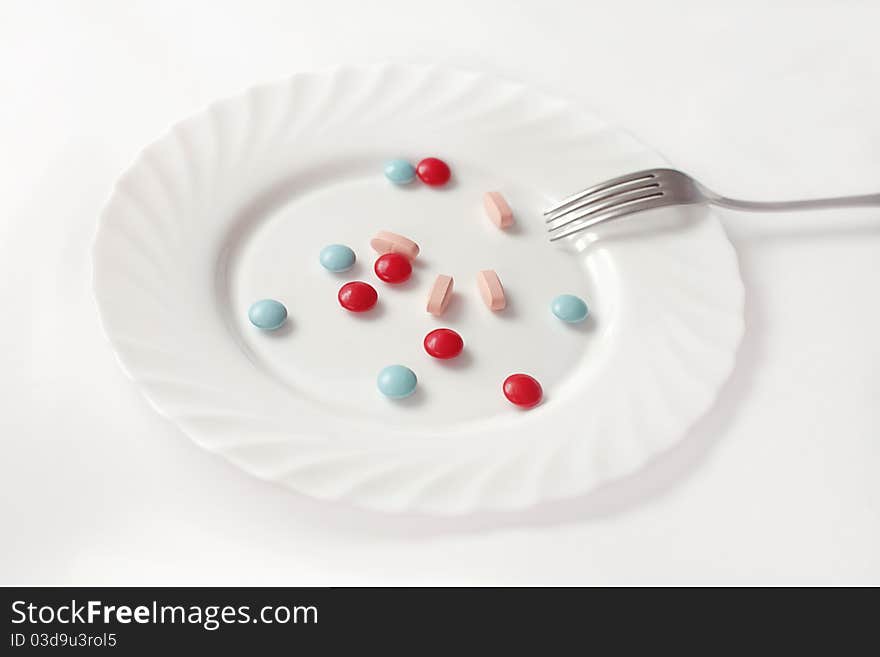 Medical pills in a plate