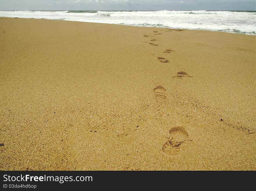 Footsteps at beach on a stormy day. Footsteps at beach on a stormy day