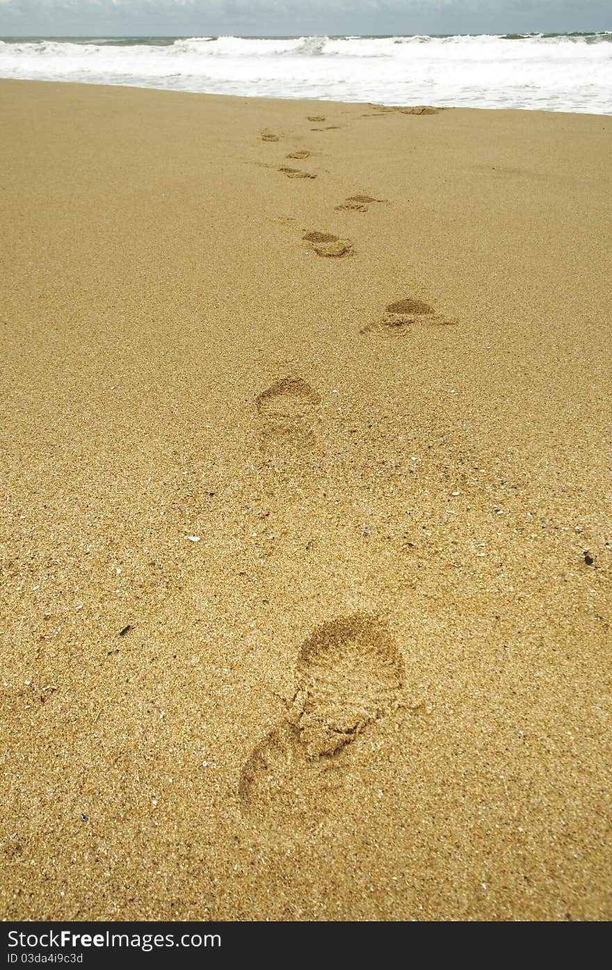 Footsteps at beach on a stormy day. Footsteps at beach on a stormy day