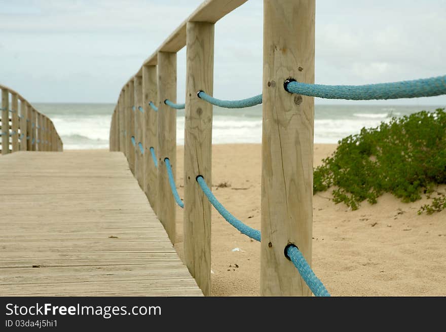 Wood access to empty beach in stormy day. Wood access to empty beach in stormy day