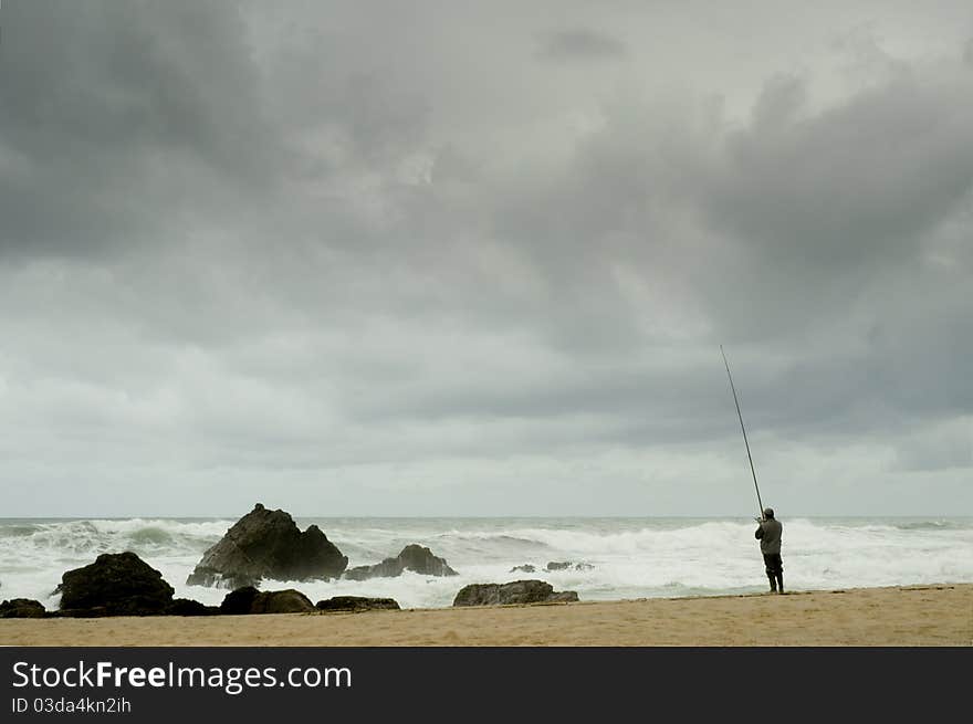 Angler at seaside