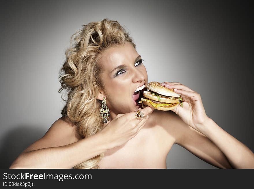 Attractive woman with burger