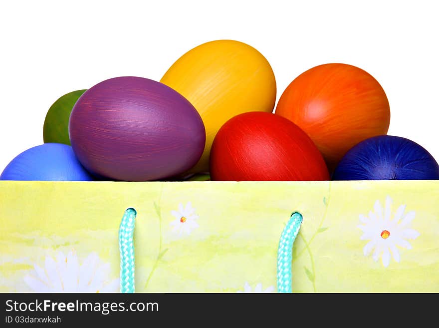 Colorful Easter eggs in gift bag, isolated on white