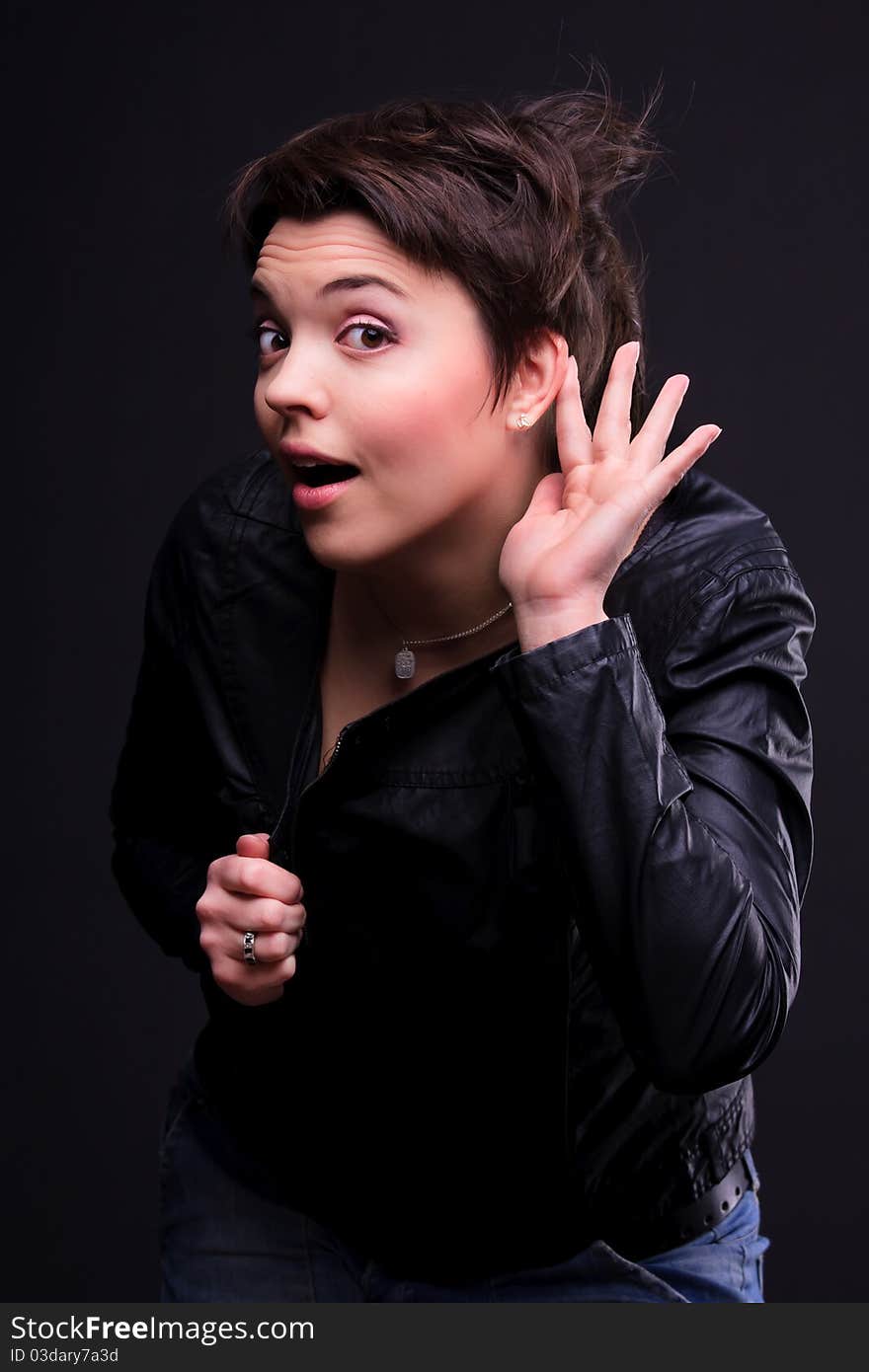 Attractive girl in a black coat posing