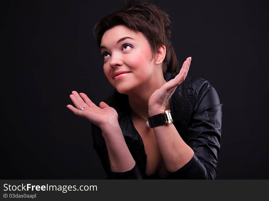 Attractive girl in a black coat posing