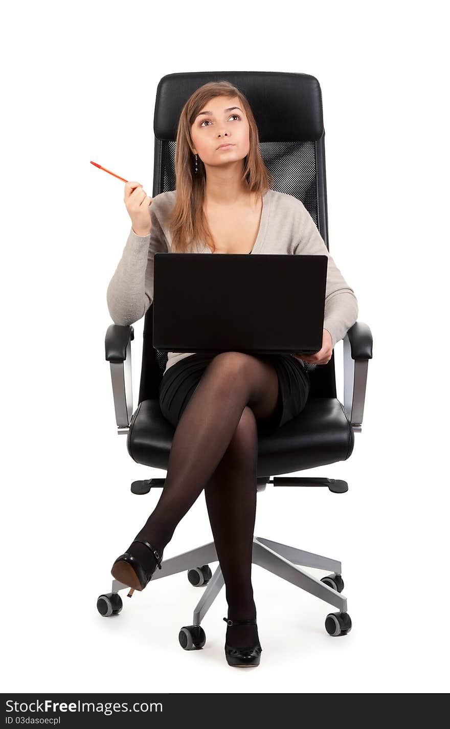 Young business lady in a chair with a laptop isolated on white background