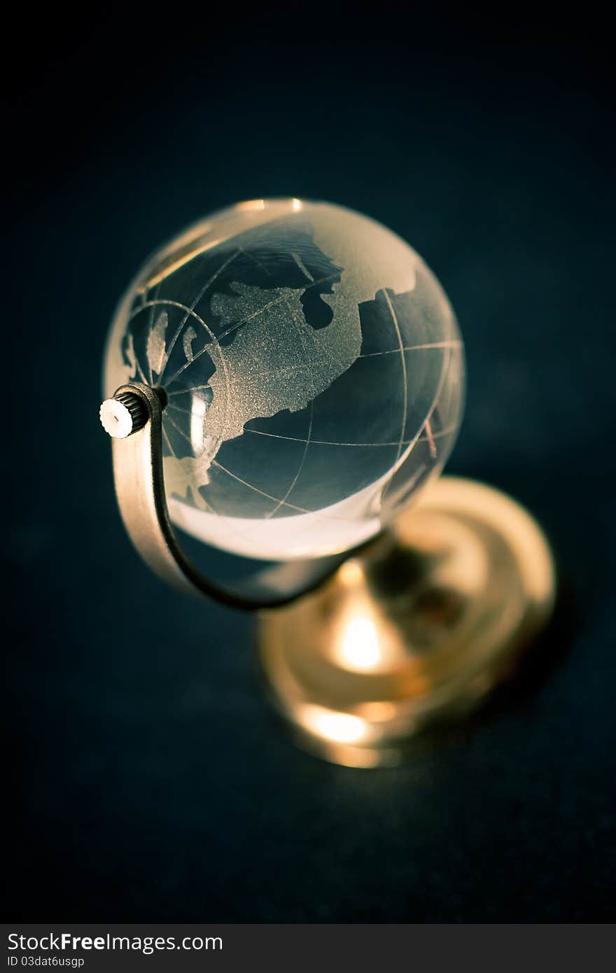 Transparent glass globe over black back