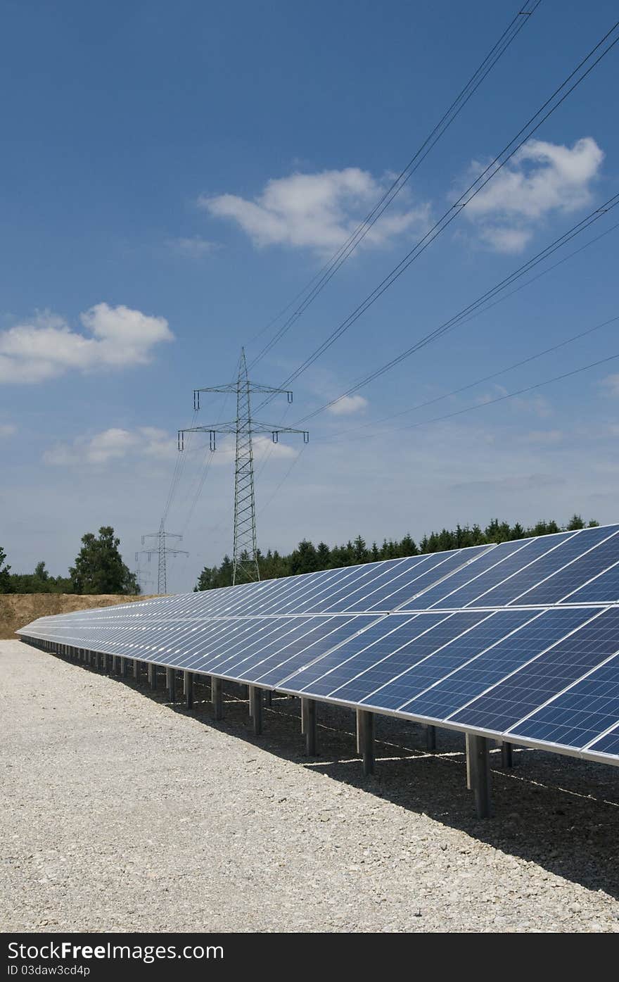 Solar panels on solar park, power poles. Solar panels on solar park, power poles