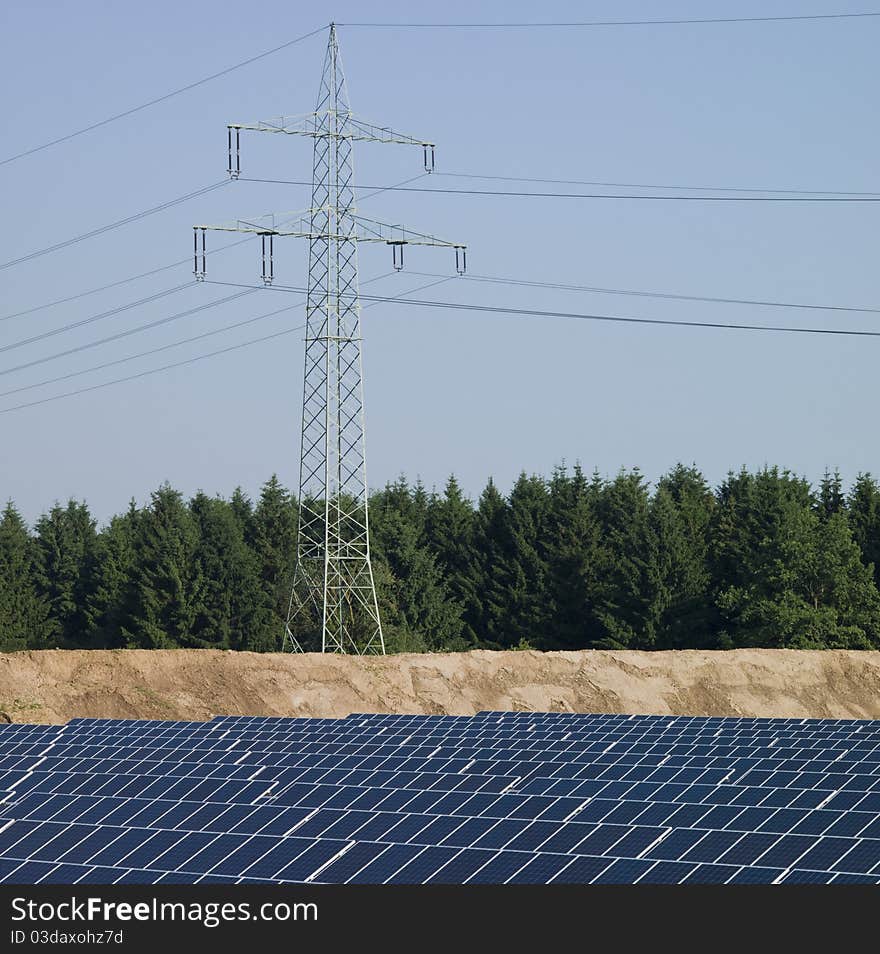 Power pole and solar panels, elevated view. Power pole and solar panels, elevated view