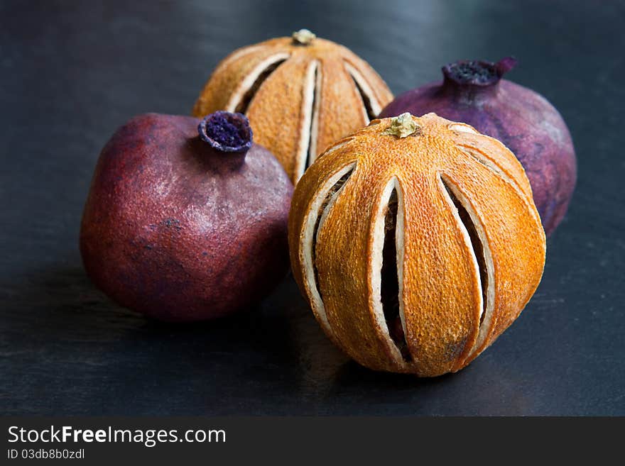 Pomegranates & oranges, dried & spraypainted for use as pot pourri. Pomegranates & oranges, dried & spraypainted for use as pot pourri