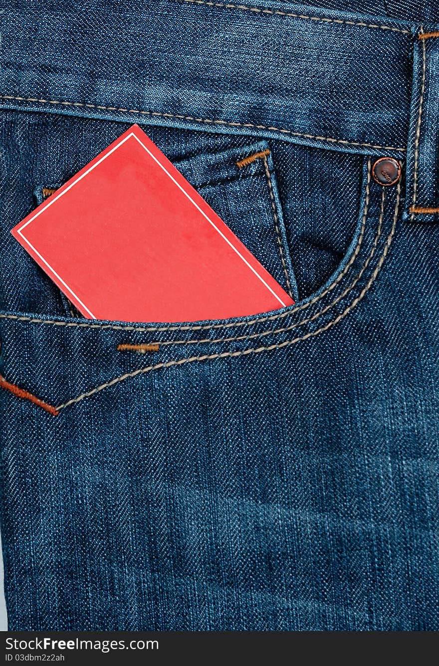 Red note paper in jeans front pocket