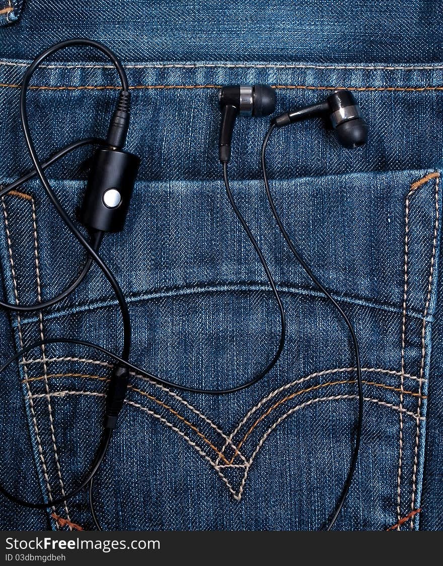 Earphones in back pocket blue jeans. Earphones in back pocket blue jeans