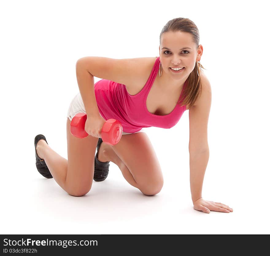 Smiling woman in fitness clothes working out with weights