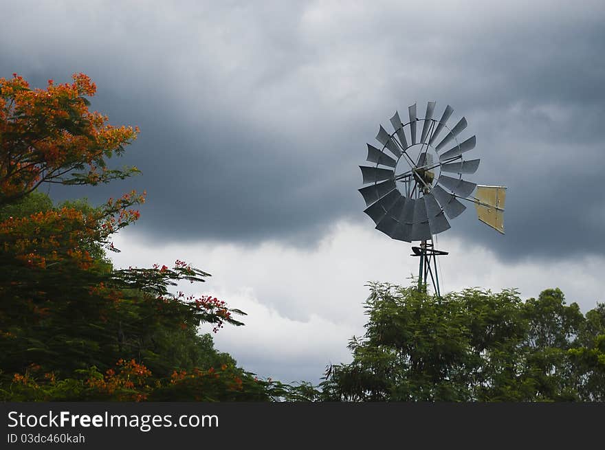 Windmill on a cloudy sky