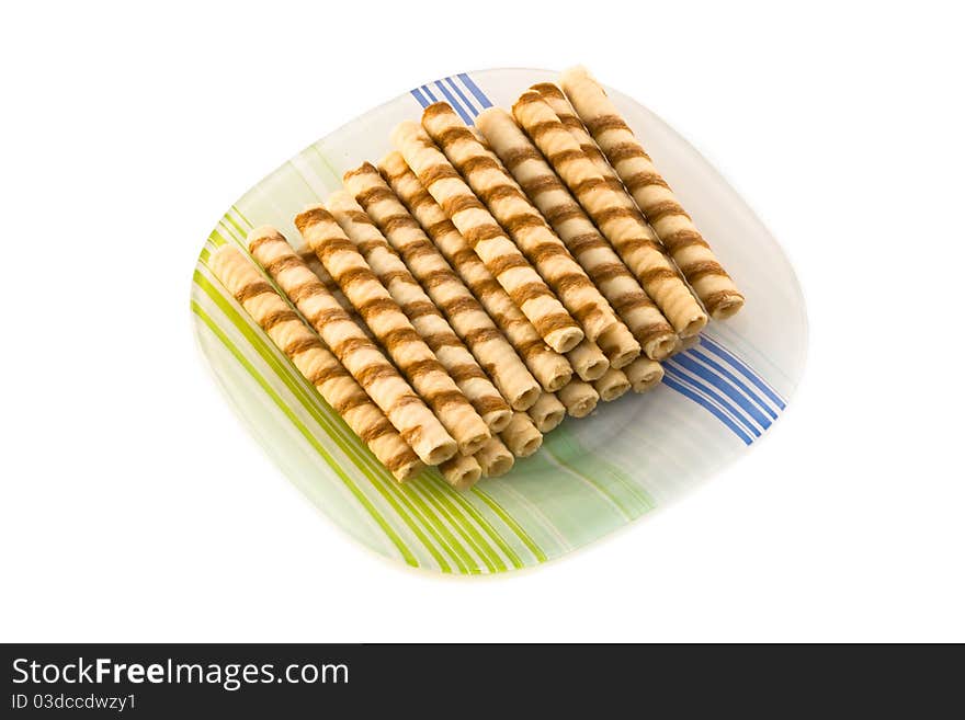 Plate of fresh baked cookies isolated on a white background.