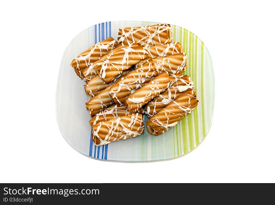 Plate of fresh baked cookies isolated on a white background.