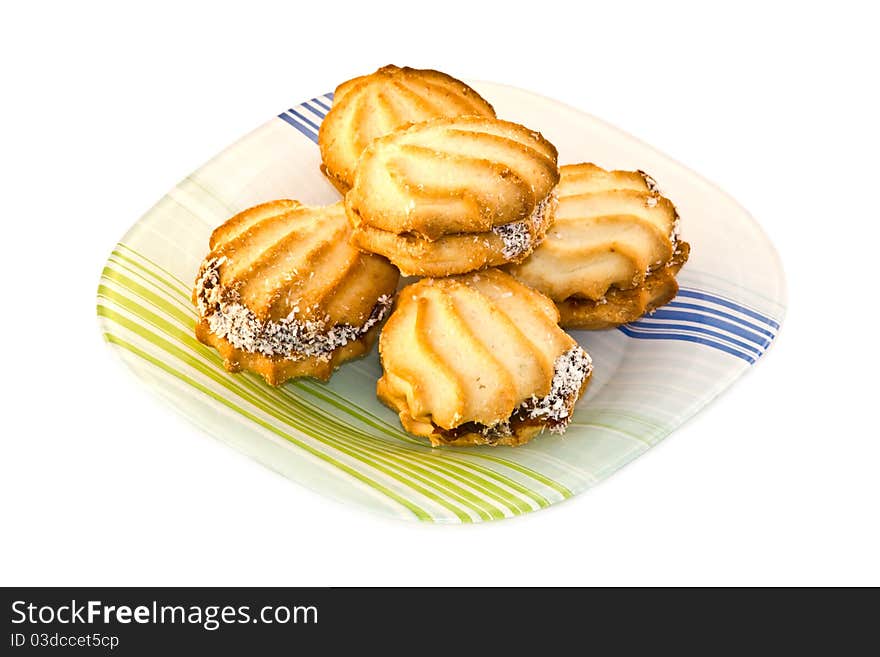 Plate of fresh baked cookies isolated on a white background.