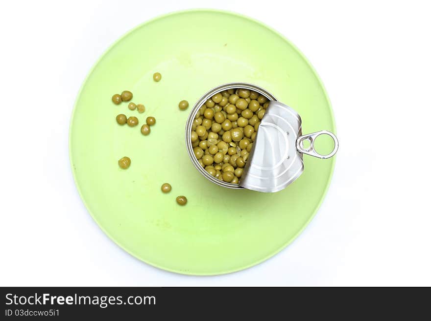 Green peas in a bowl with a fork and spoon