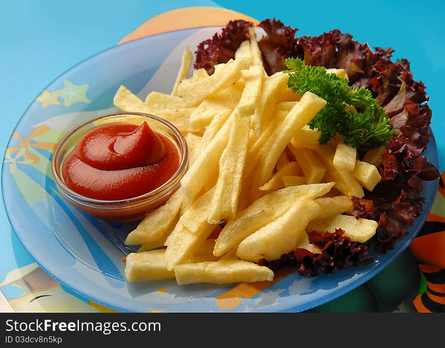 fried potatoes with gravy and vegetables on the plate