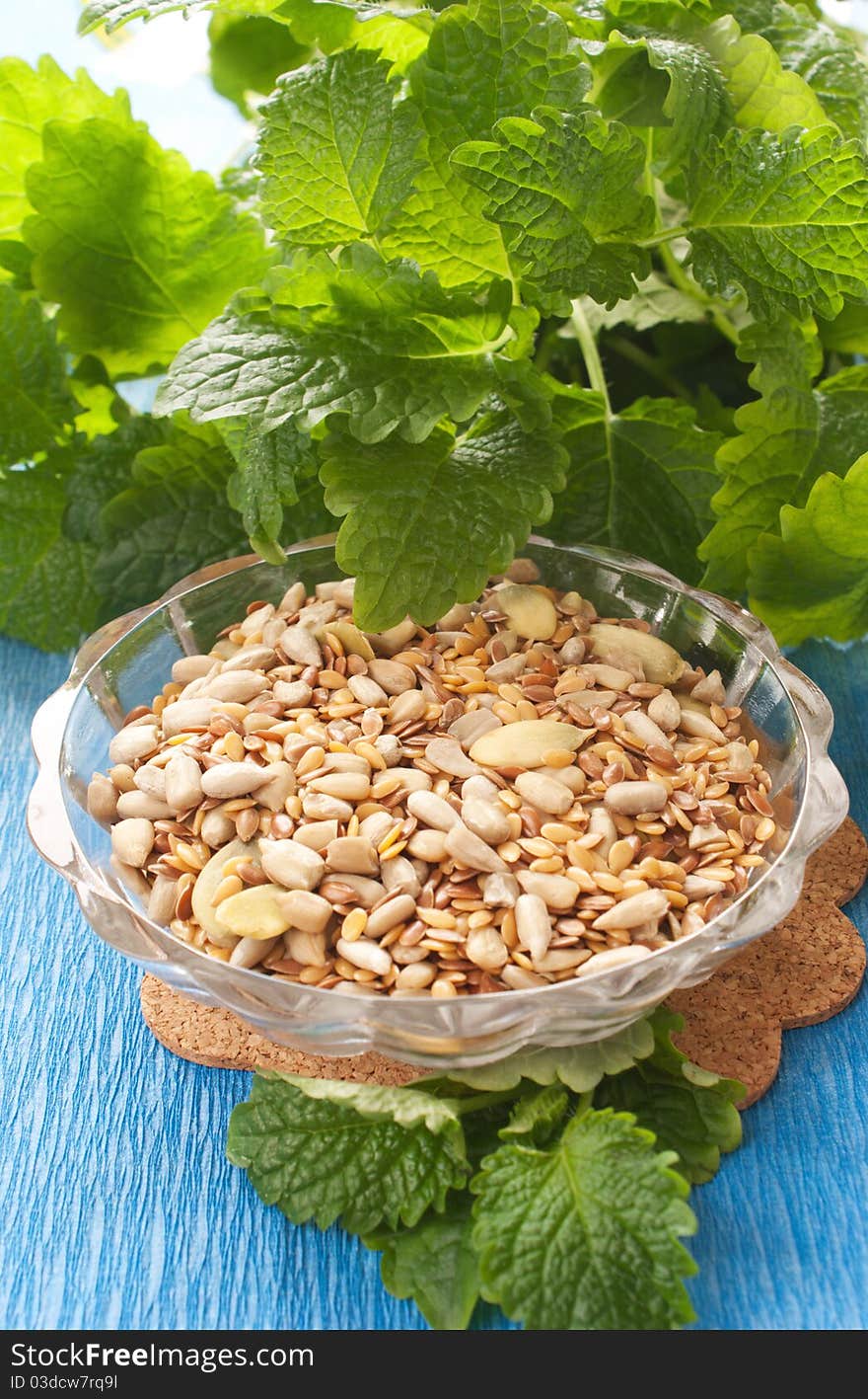 Seeds in  bowl with herbs