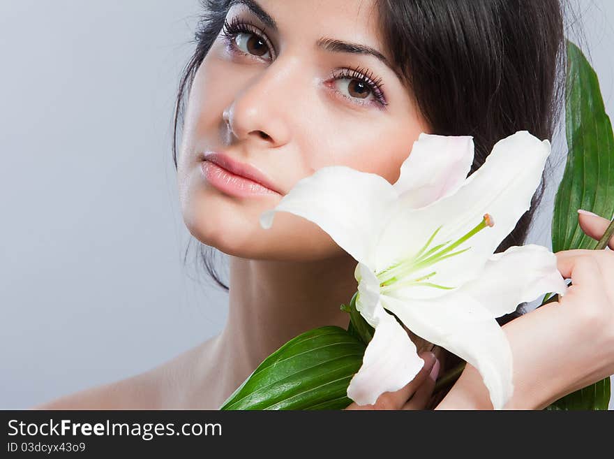 Beautiful woman with lily