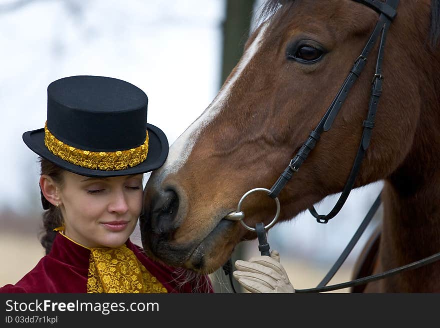 Horsewoman in vintage stylized suit.