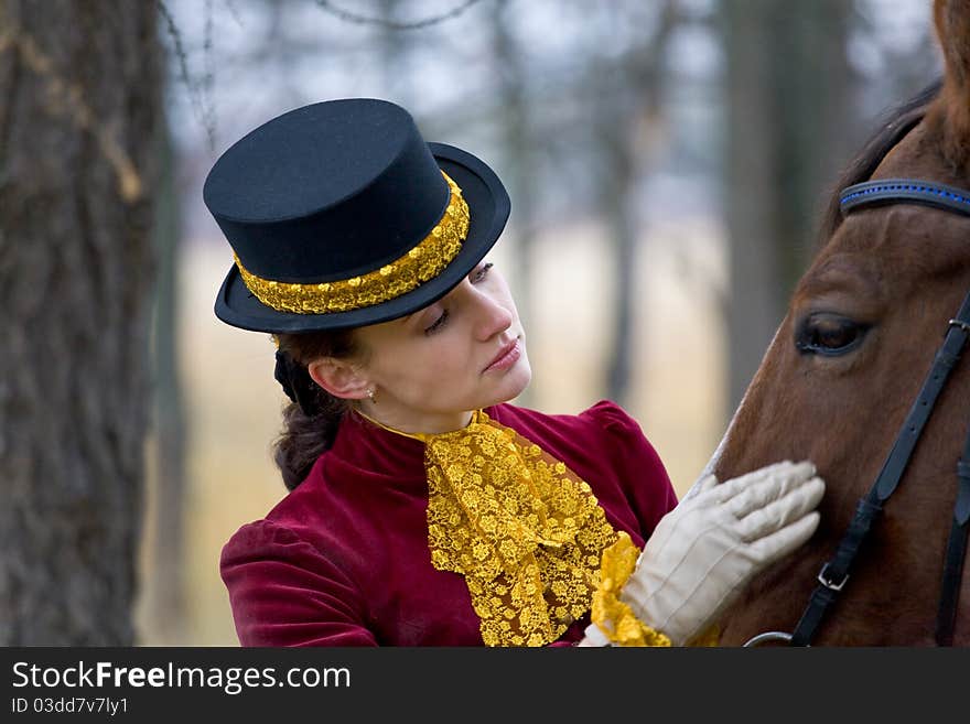 Horsewoman in vintage stylized suit.