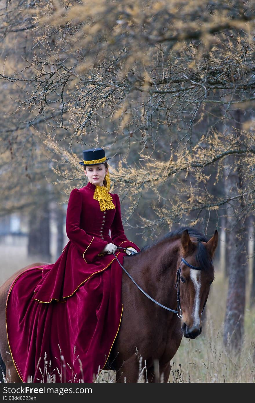 Horsewoman in vintage stylized suit.