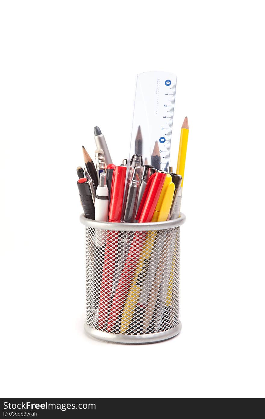 Metal holder with different pens and pencils