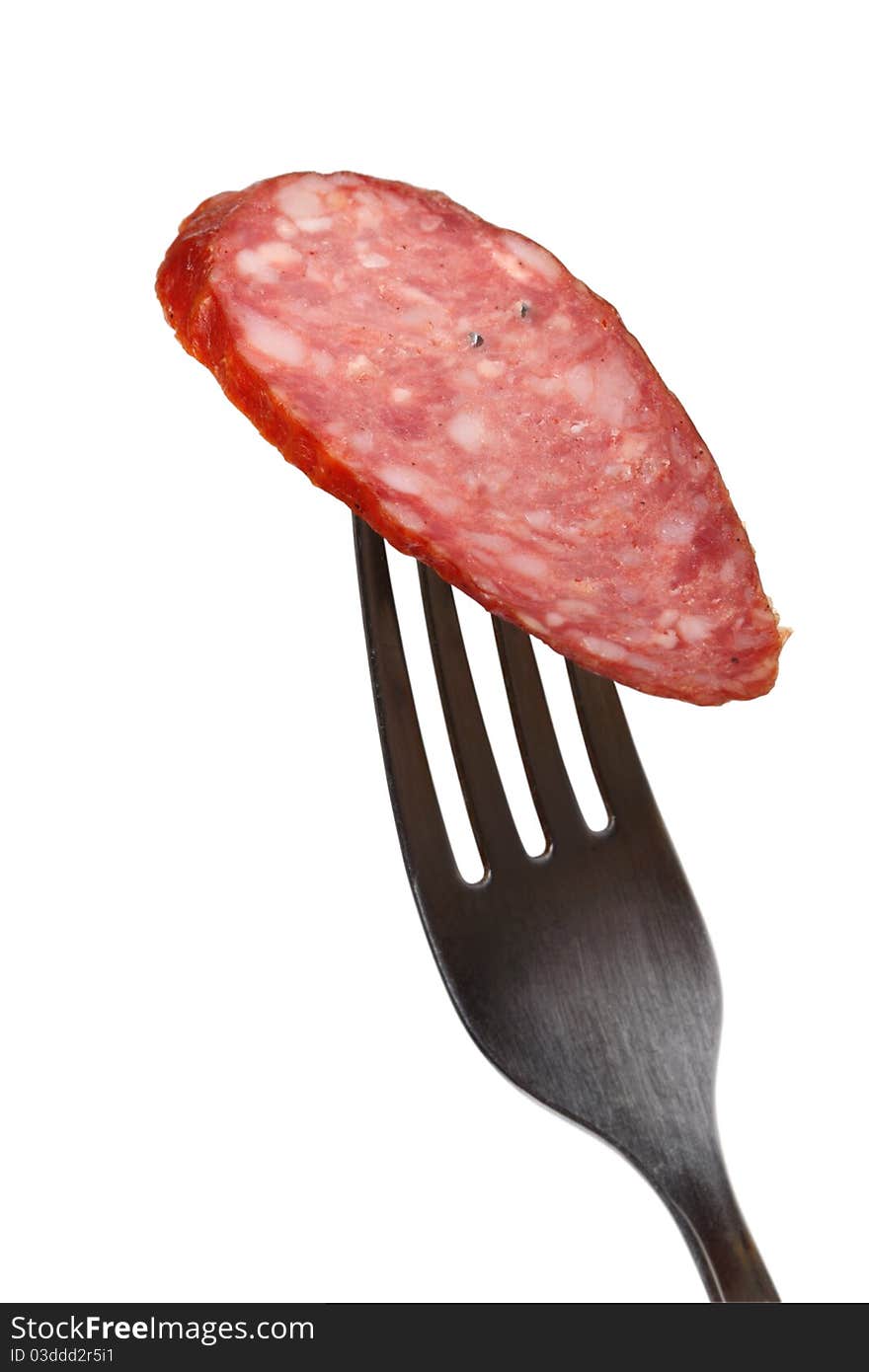 Smoked sausage on a fork