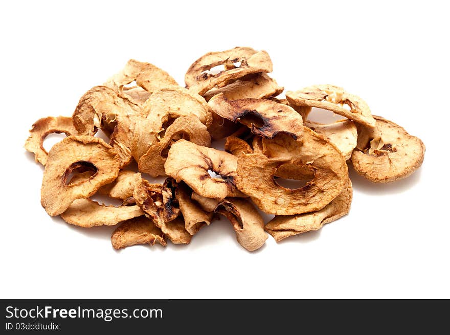 Dried apple slices over a white background