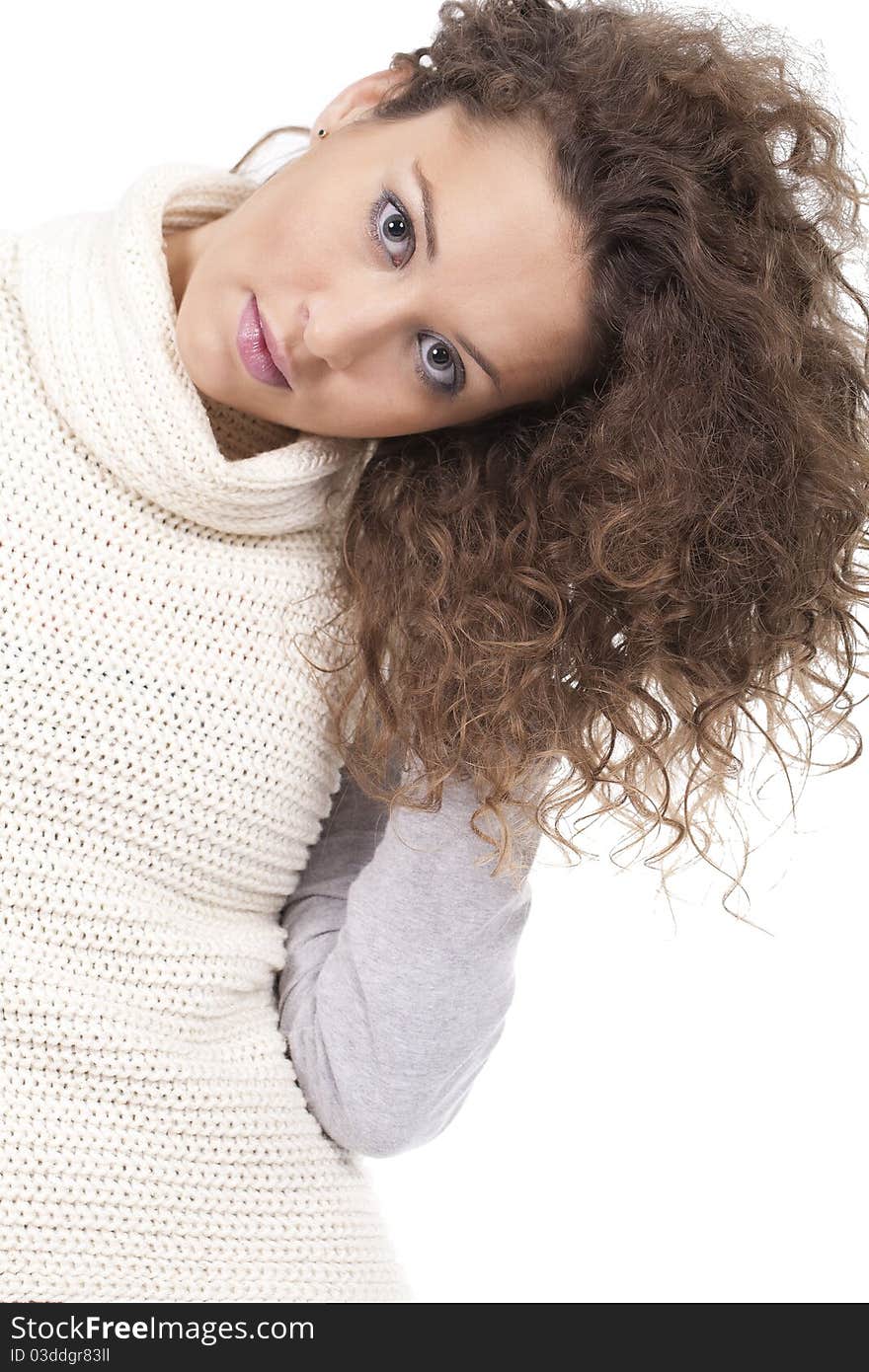 A beautiful and young woman with blonde and curtly hair posing. A beautiful and young woman with blonde and curtly hair posing