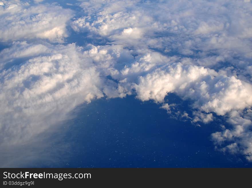 Photograph taken above the clouds over the Pacific Ocean.